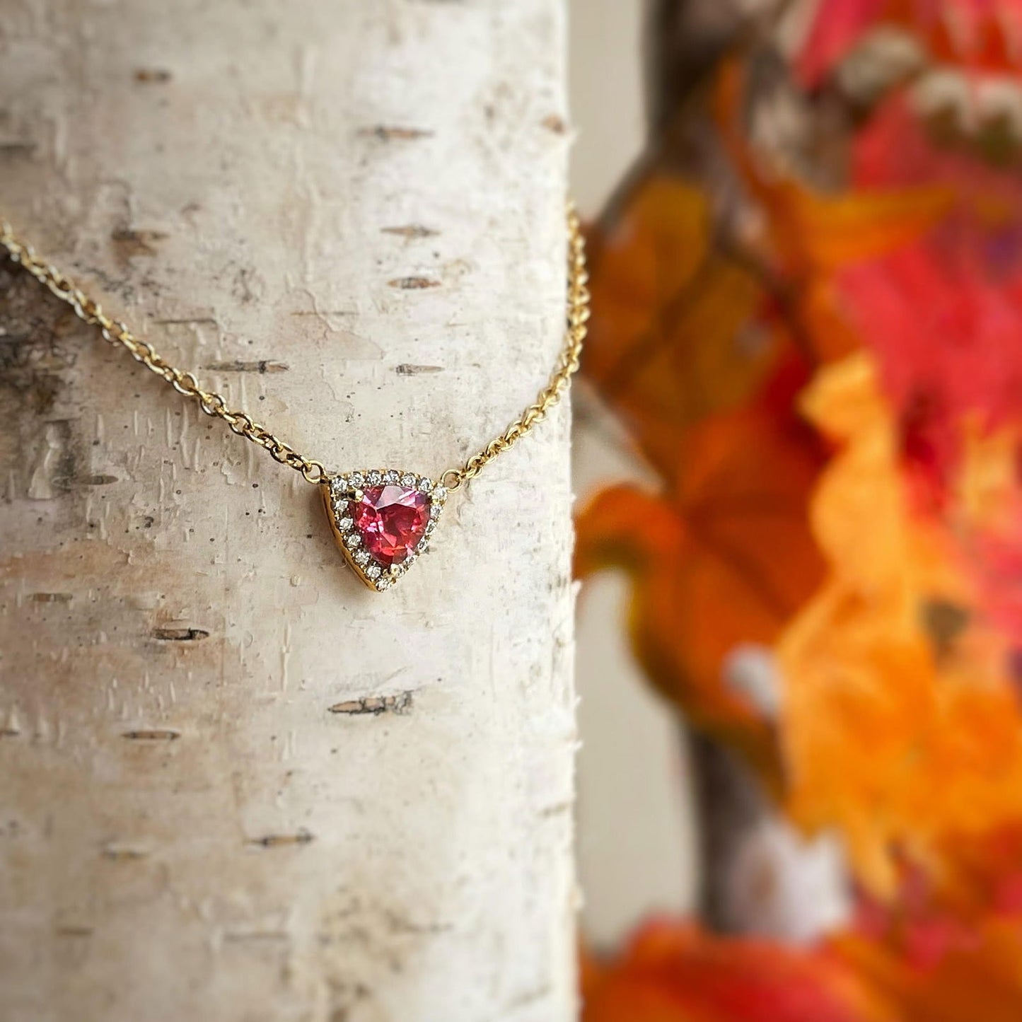 Photo of Kim Collins Pink Tourmaline Necklace in a decorative scene, designed by , available at Plumb Gold & Plumb Silver
