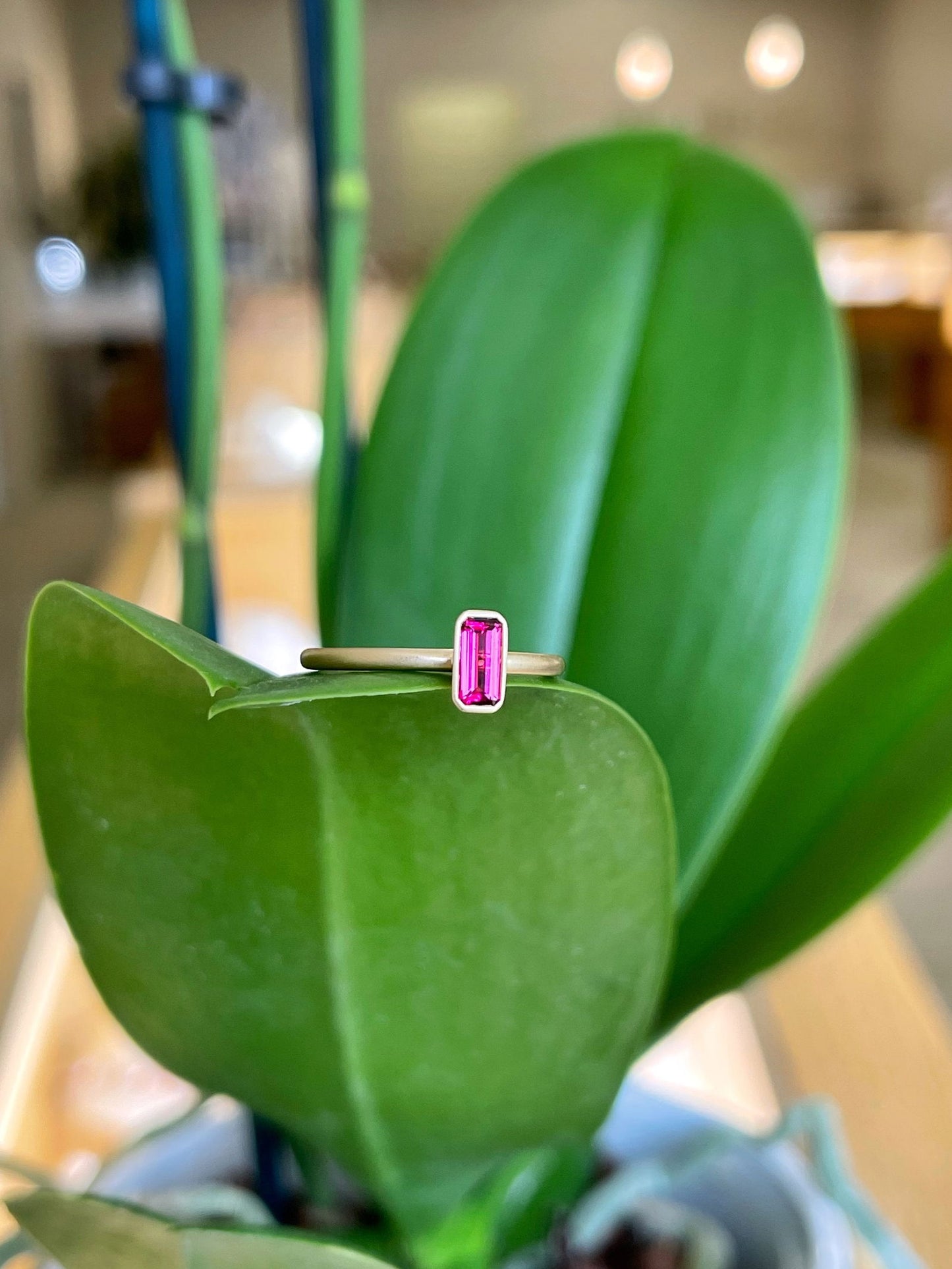 Photo of Kim Collins Pink Tourmaline Yumdrop in a decorative scene, designed by , available at Plumb Gold & Plumb Silver