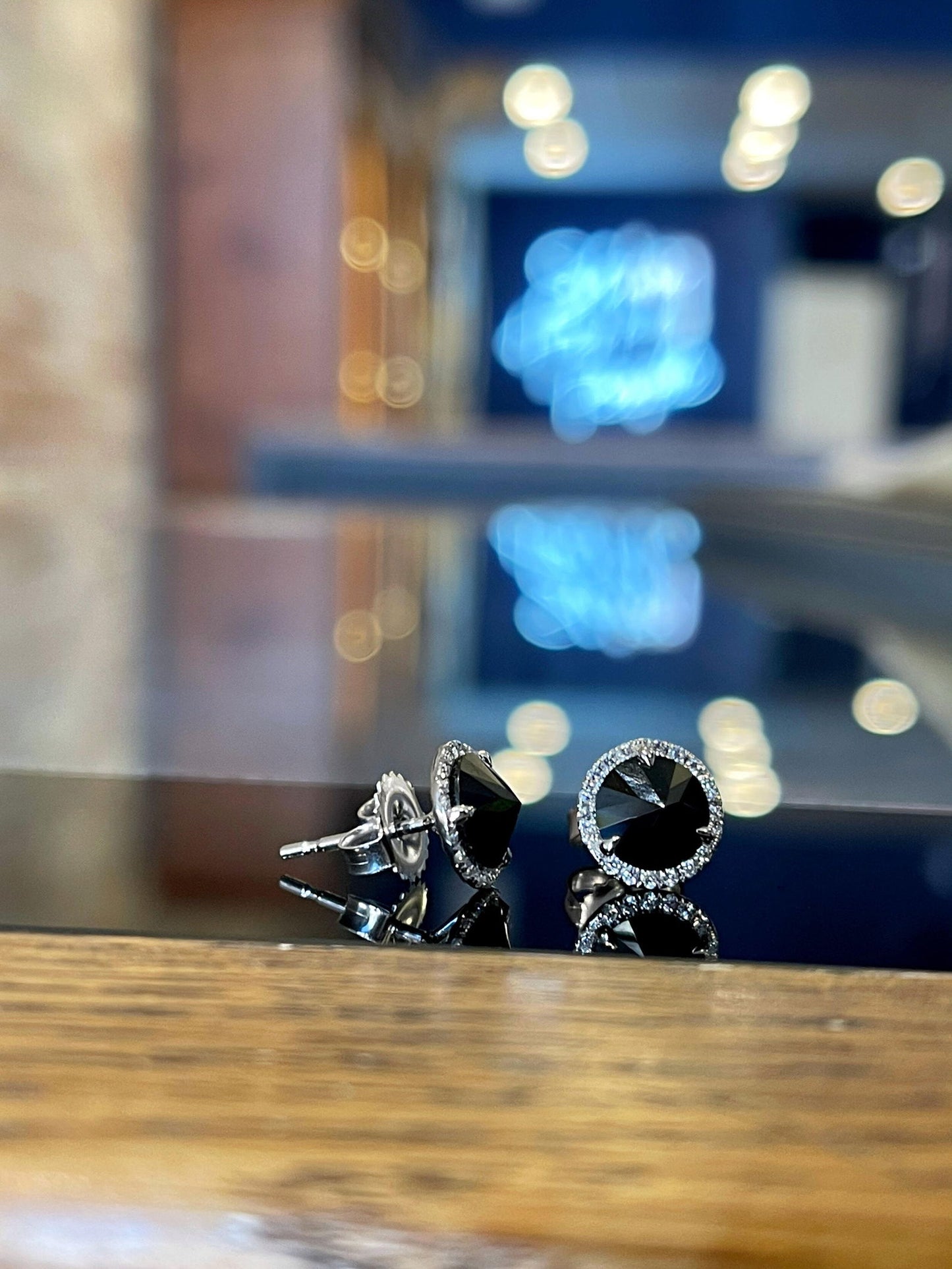 Photo of Kimberly Collins Black Spinel and Diamond Studs in a decorative scene, designed by , available at Plumb Gold & Plumb Silver