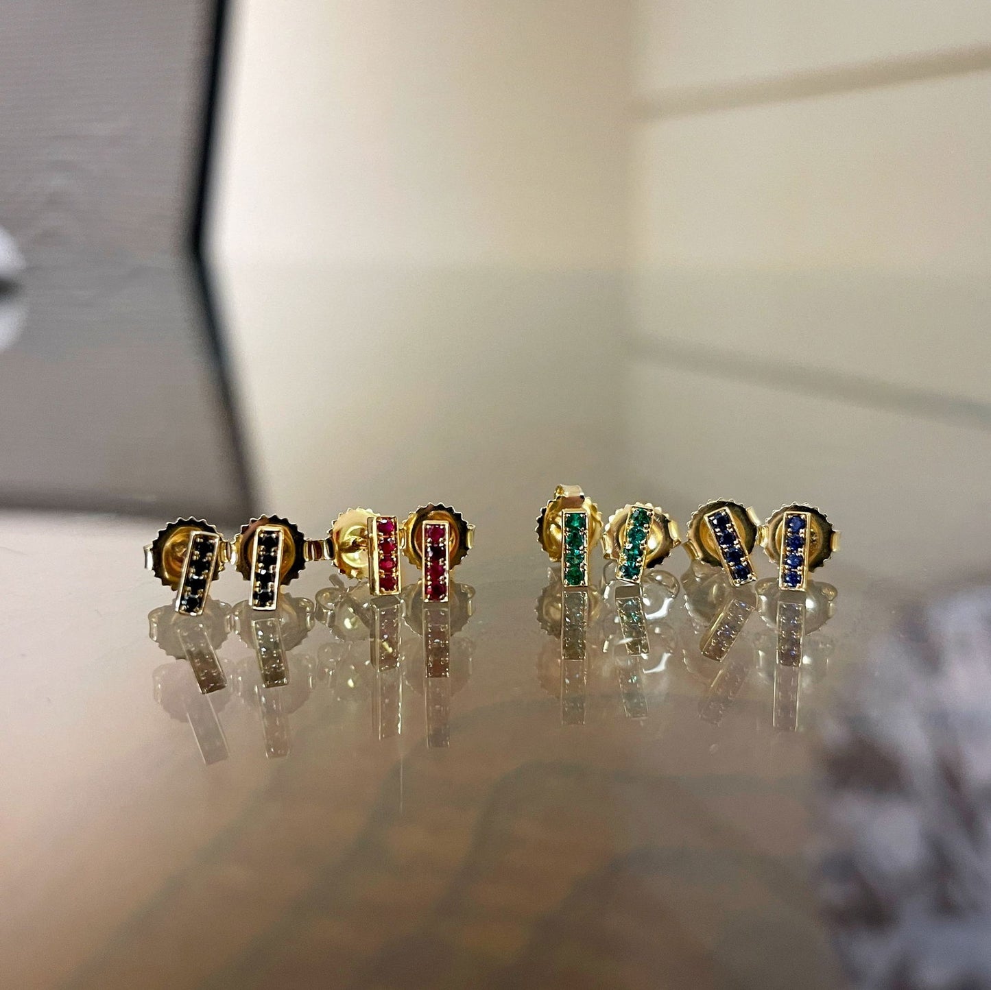 Photo of Kimberly Collins Stick Studs in a decorative scene, designed by , available at Plumb Gold & Plumb Silver