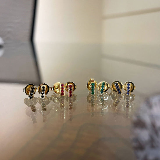 Photo of Kimberly Collins Stick Studs in a decorative scene, designed by , available at Plumb Gold & Plumb Silver