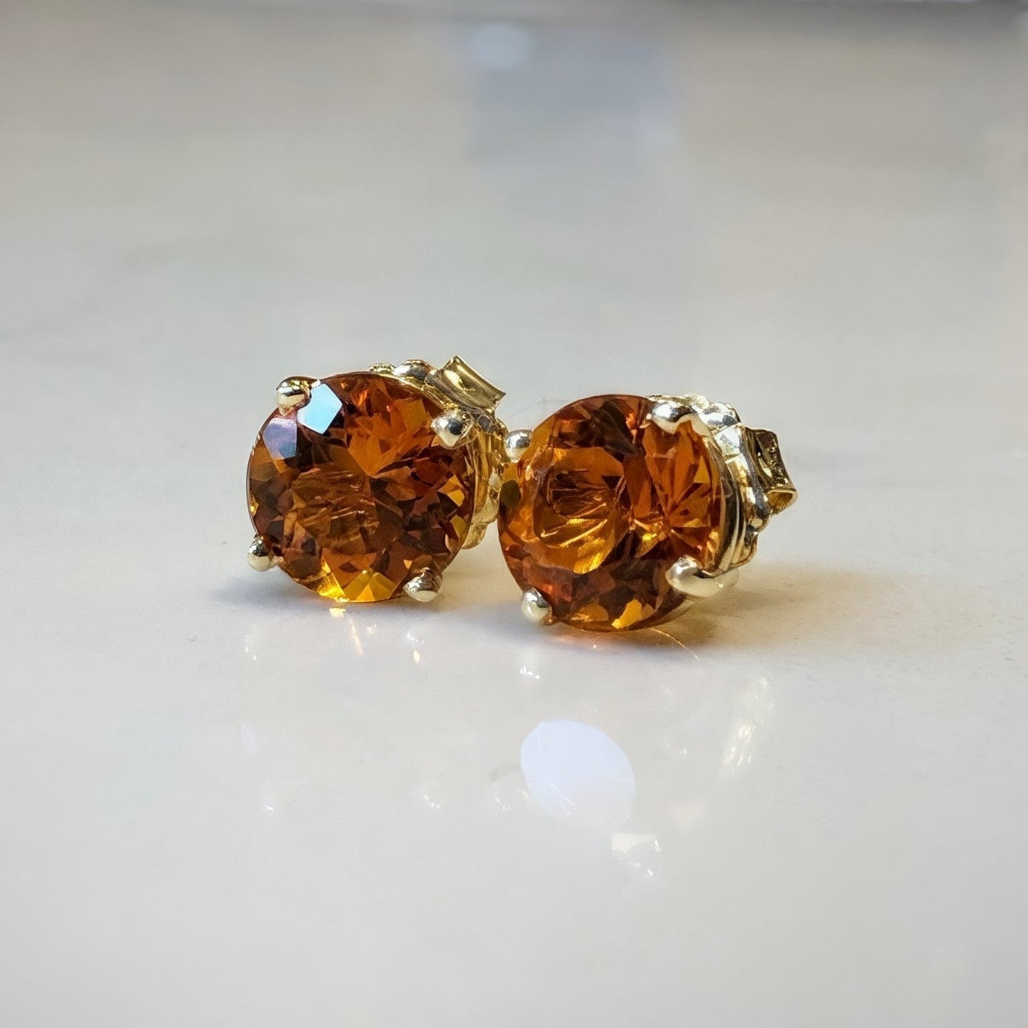 Photo of Large Citrine Studs in a decorative scene, designed by -, available at Plumb Gold & Plumb Silver