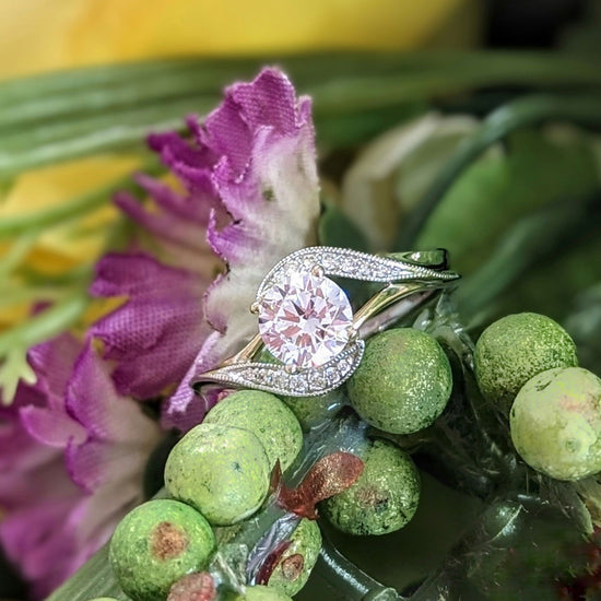 Photo of "Magnolia" Curve Bypass Engagement Ring in a decorative scene, designed by , available at Plumb Gold & Plumb Silver