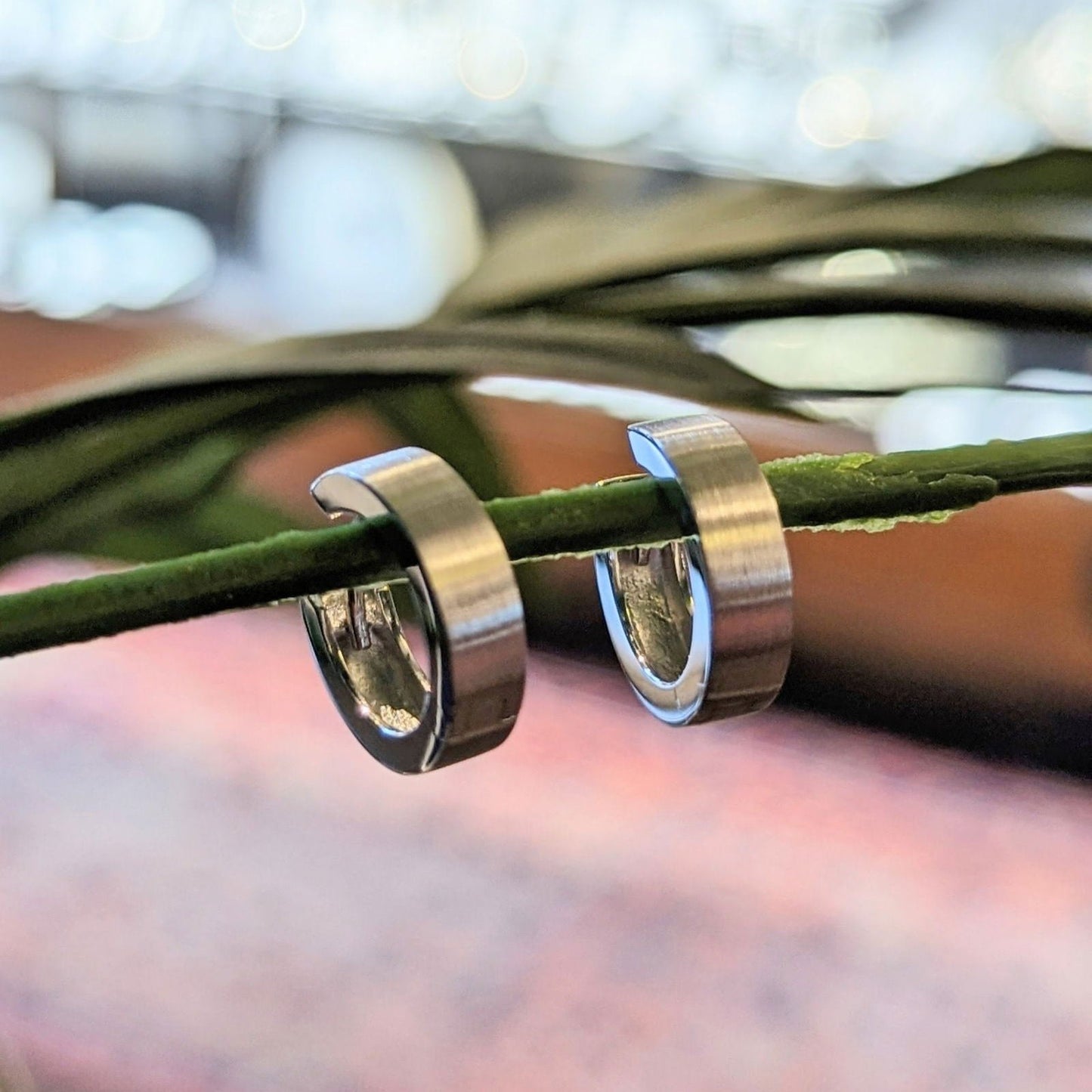 Photo of Matte Finish Simple Hoops in a decorative scene, designed by , available at Plumb Gold & Plumb Silver