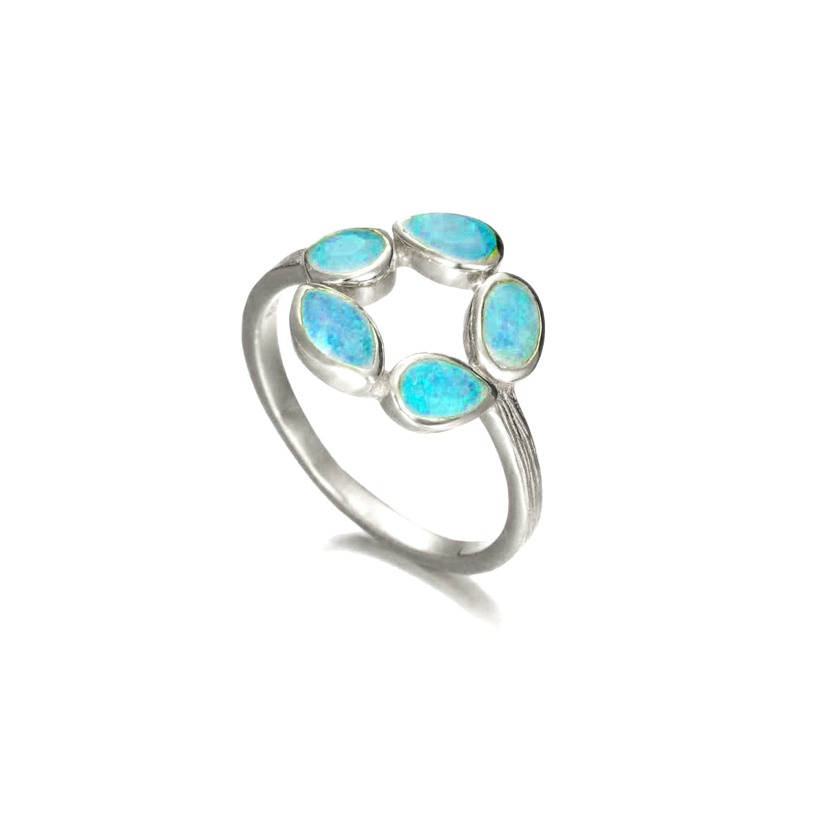 Photo of “Morning” Ring in a decorative scene, designed by , available at Plumb Gold & Plumb Silver