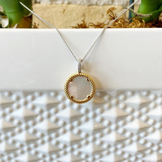 Photo of Mother of Pearl Necklace in a decorative scene, designed by , available at Plumb Gold & Plumb Silver