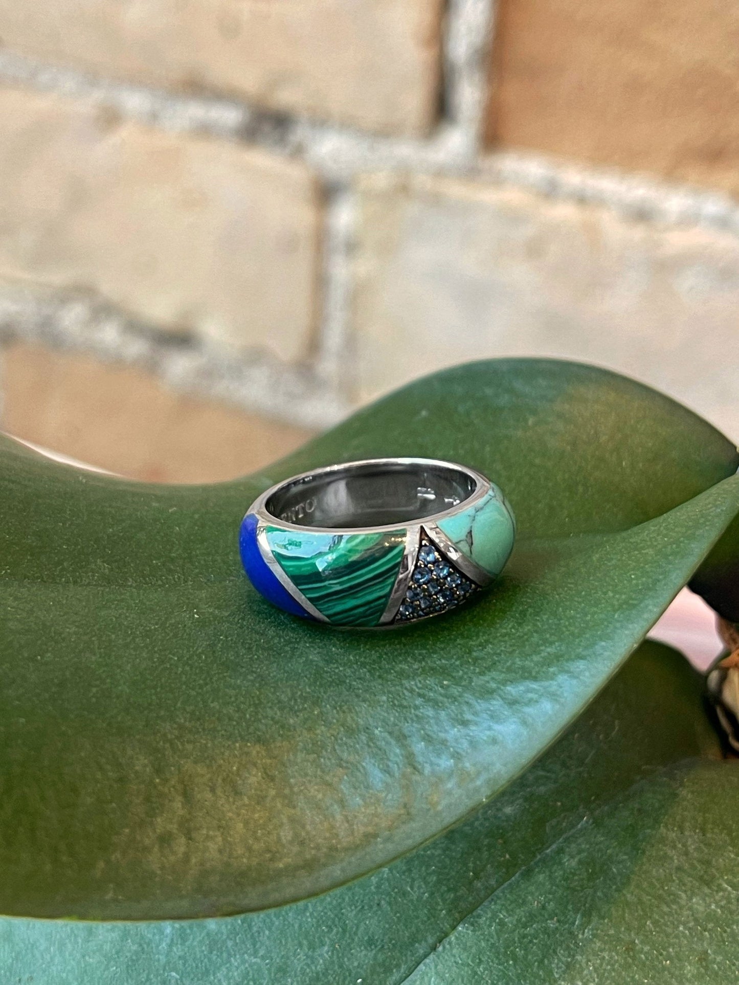 Photo of Multi-Color Ring in a decorative scene, designed by , available at Plumb Gold & Plumb Silver
