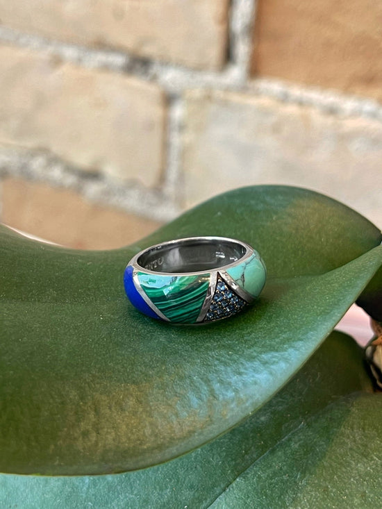 Photo of Multi-Color Ring in a decorative scene, designed by , available at Plumb Gold & Plumb Silver