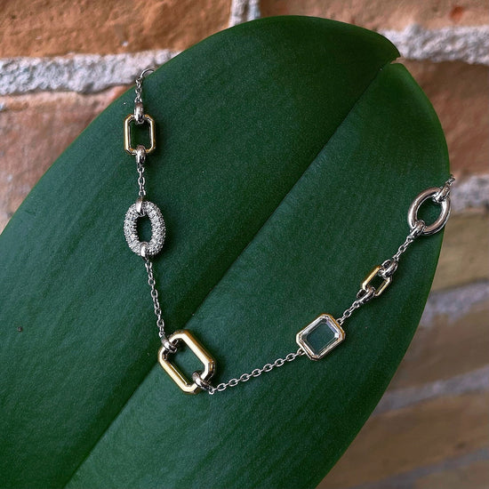 Photo of Multi-shape Bracelet in a decorative scene, designed by , available at Plumb Gold & Plumb Silver