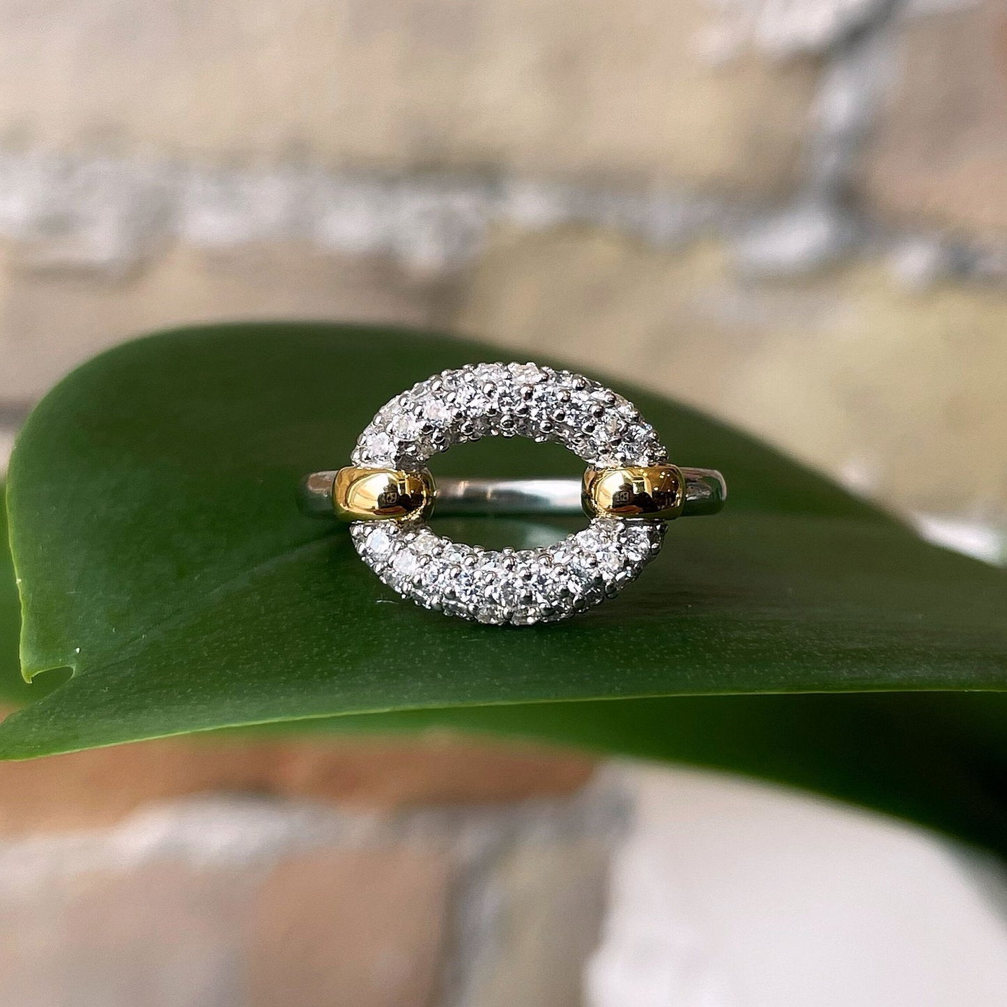 Photo of Oval Cubic Zirconia Ring in a decorative scene, designed by , available at Plumb Gold & Plumb Silver