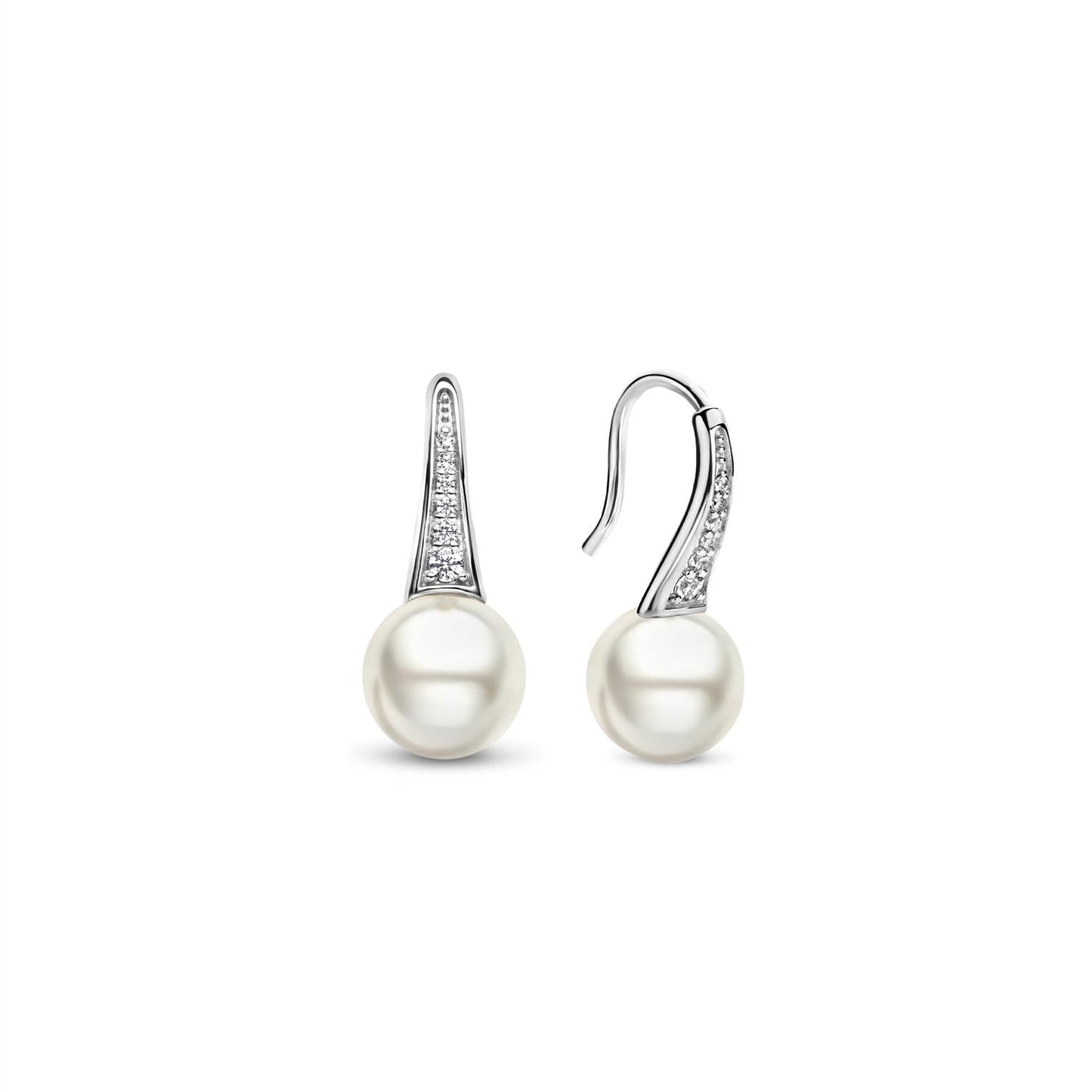 Photo of Pearl Drop Earrings in a decorative scene, designed by , available at Plumb Gold & Plumb Silver