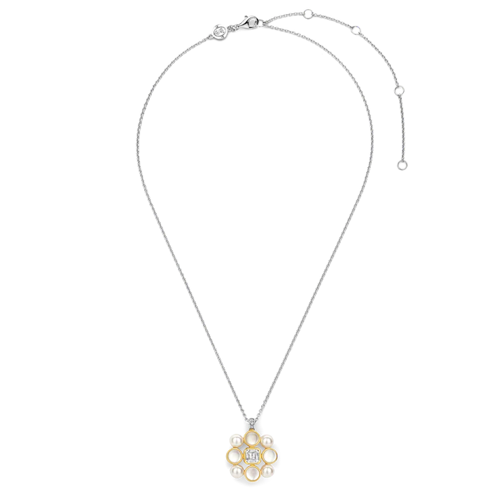 Photo of "Pearl Patchwork" Pendant in a decorative scene, designed by , available at Plumb Gold & Plumb Silver