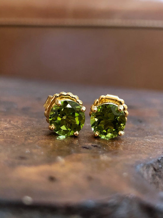 Photo of Peridot Studs in a decorative scene, designed by , available at Plumb Gold & Plumb Silver