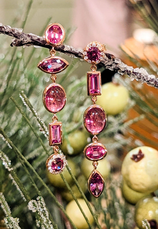 Photo of Pink Multi-Gem Dangle Earrings in a decorative scene, designed by , available at Plumb Gold & Plumb Silver