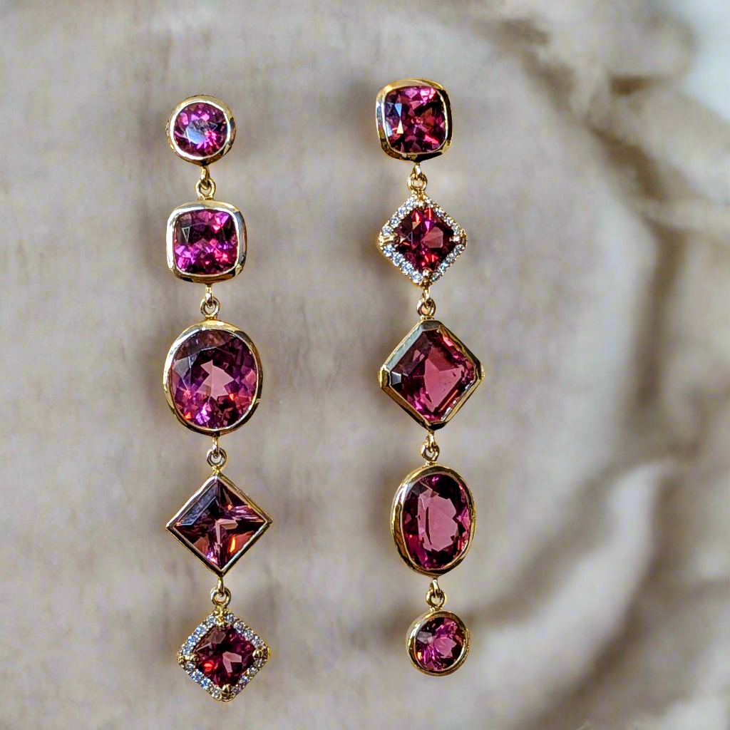 Photo of Pink Multi Dangle Earrings in a decorative scene, designed by , available at Plumb Gold & Plumb Silver