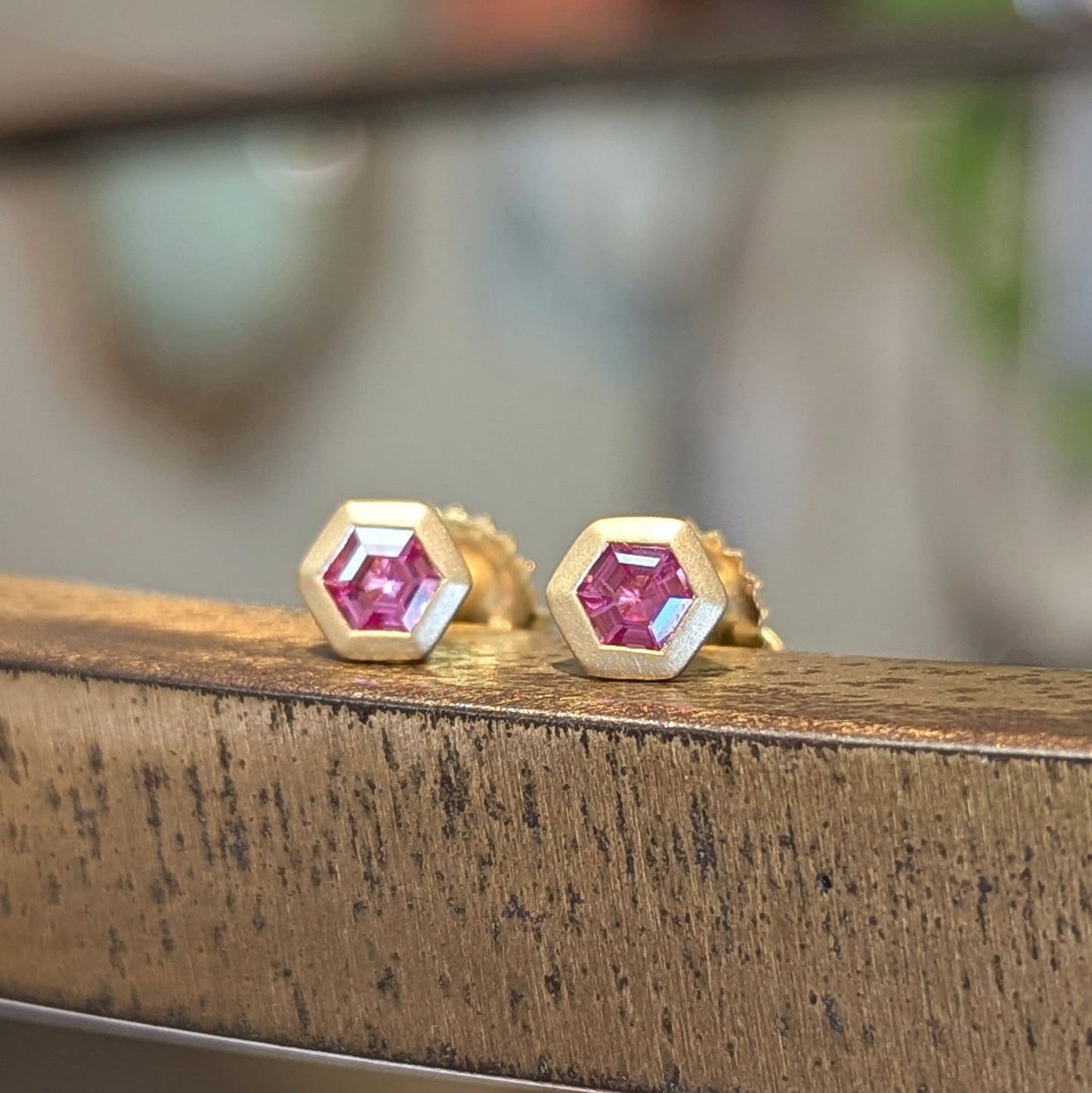 Photo of Pink Spinel Hex Studs in a decorative scene, designed by , available at Plumb Gold & Plumb Silver