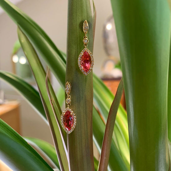 Photo of Pink Tourmaline Marquise Dangle Earrings in a decorative scene, designed by , available at Plumb Gold & Plumb Silver