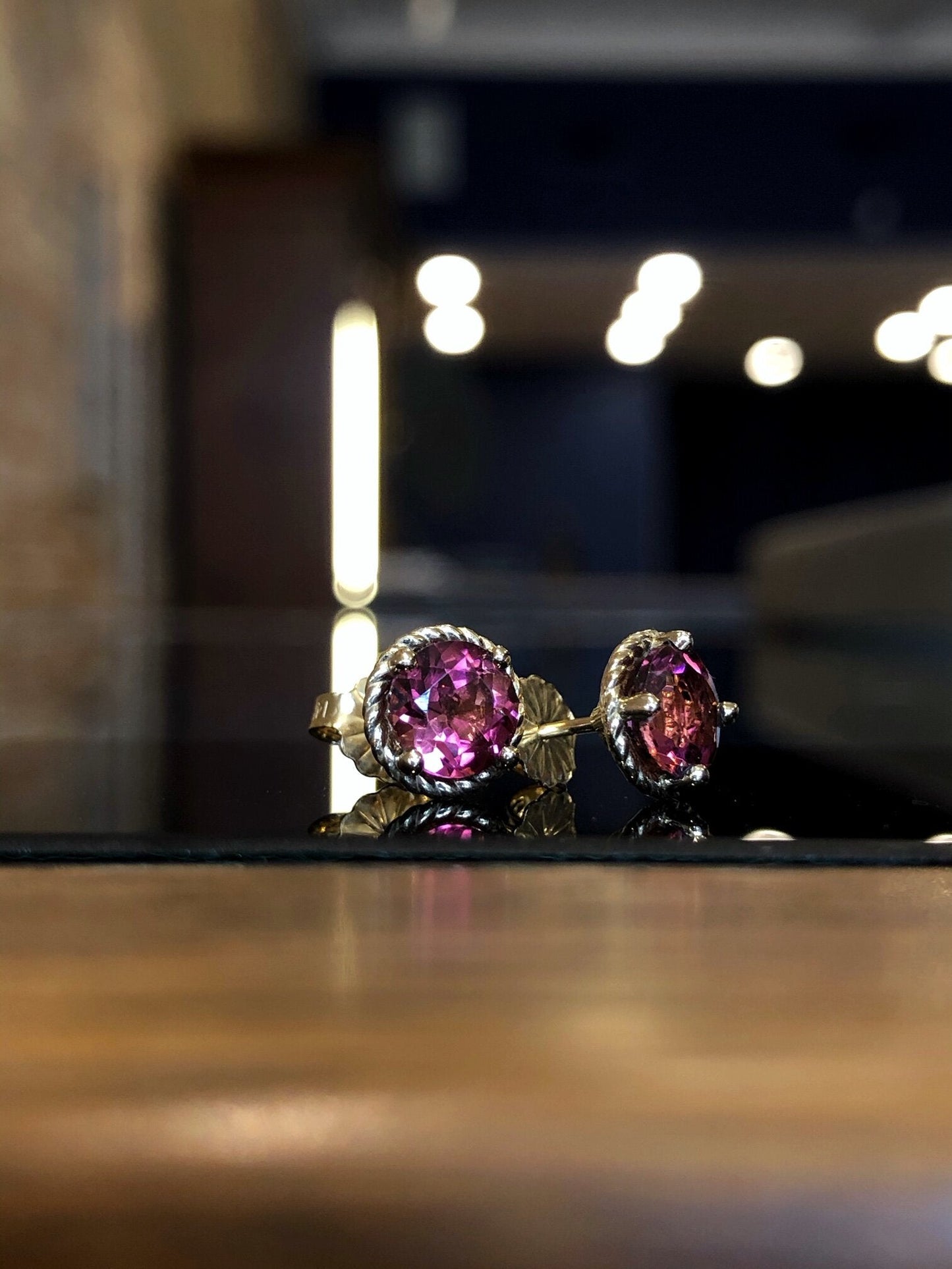 Photo of Pink Tourmaline Studs in a decorative scene, designed by , available at Plumb Gold & Plumb Silver