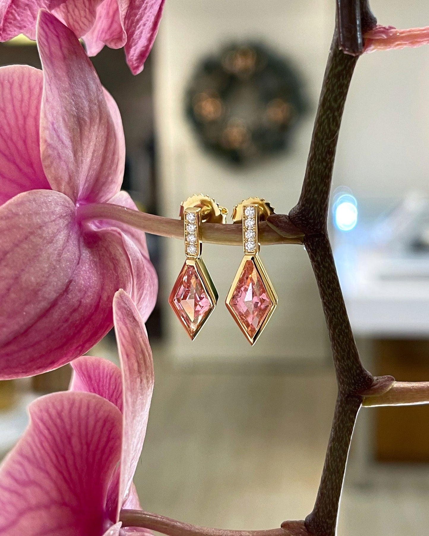 Photo of Pink Tourmaline and Diamond Dangles in a decorative scene, designed by , available at Plumb Gold & Plumb Silver