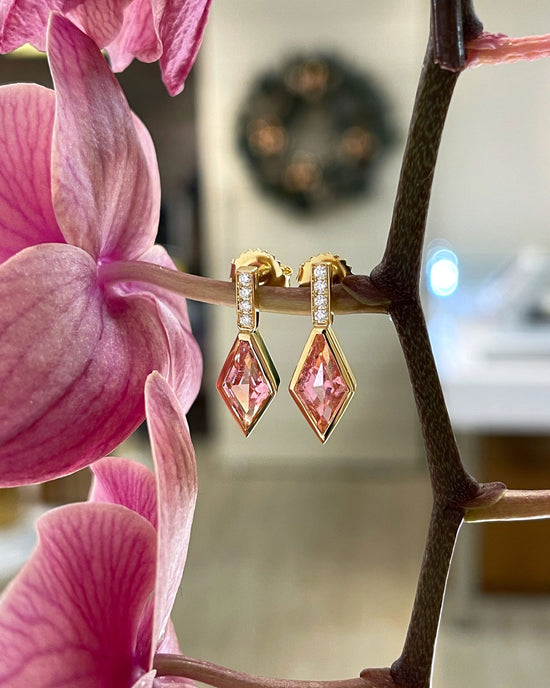 Photo of Pink Tourmaline and Diamond Dangles in a decorative scene, designed by , available at Plumb Gold & Plumb Silver