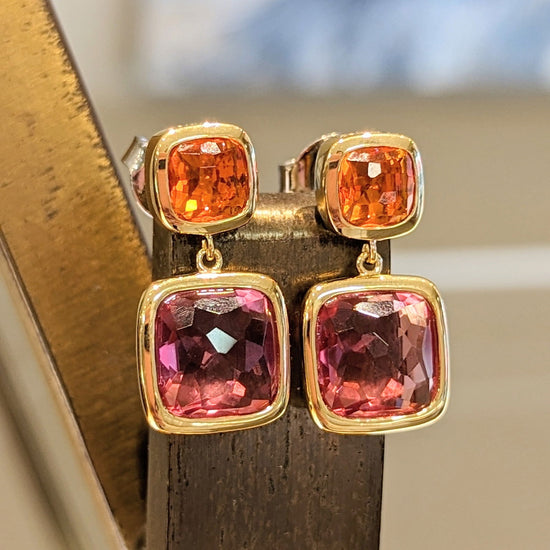 Photo of Pink and Orange CZ Drop Earring in a decorative scene, designed by , available at Plumb Gold & Plumb Silver