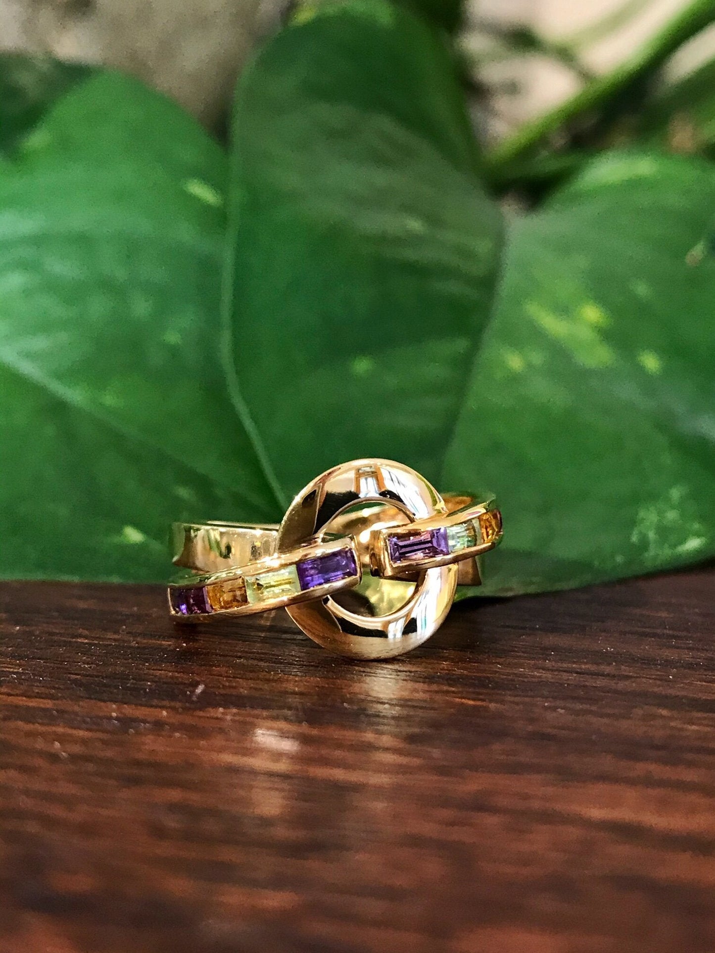 Photo of Plumb Gold Legacy Multi-Stone Ring in a decorative scene, designed by , available at Plumb Gold & Plumb Silver