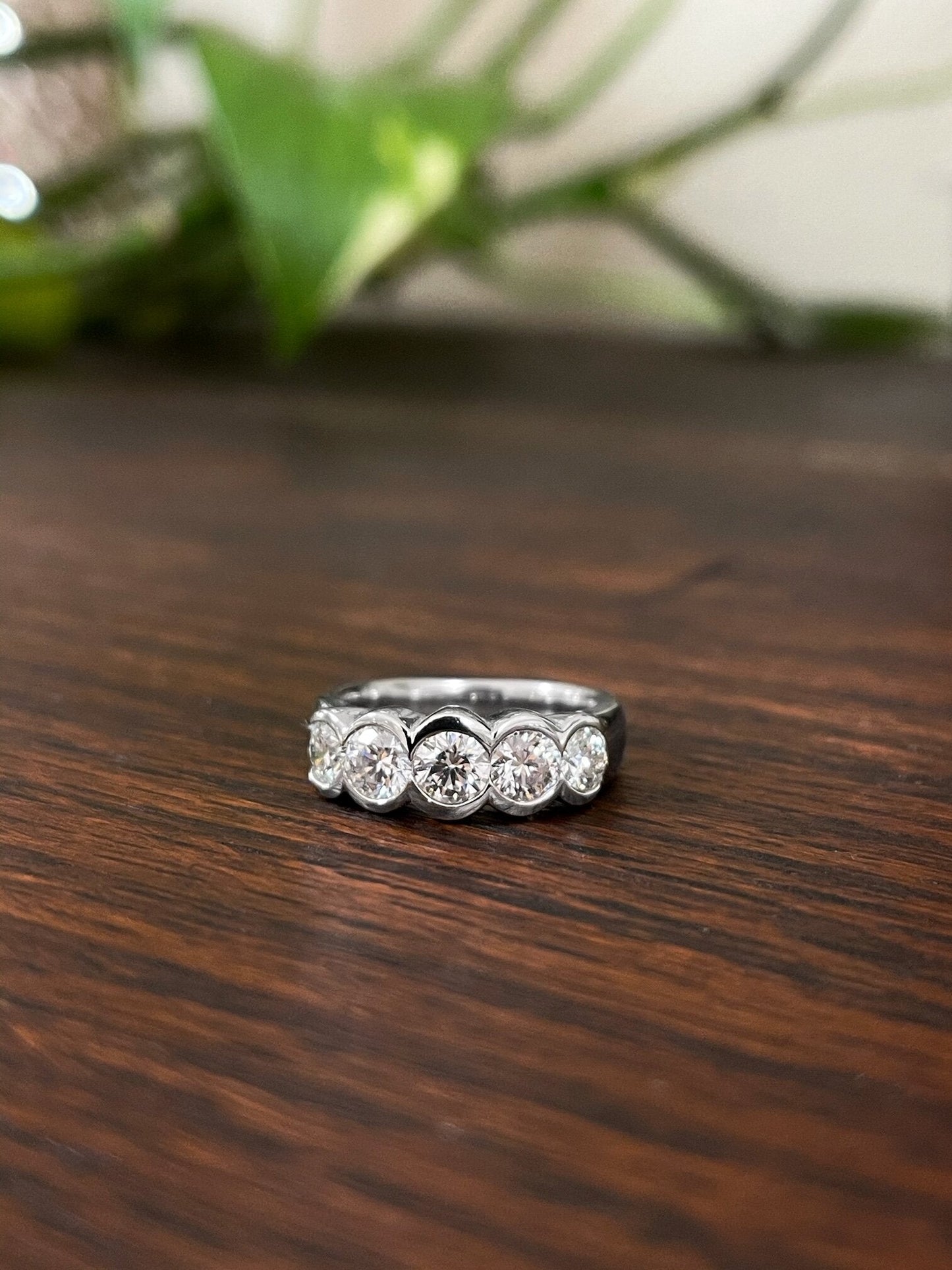 Photo of Plumb Gold Original Platinum Diamond Statement Band in a decorative scene, designed by , available at Plumb Gold & Plumb Silver