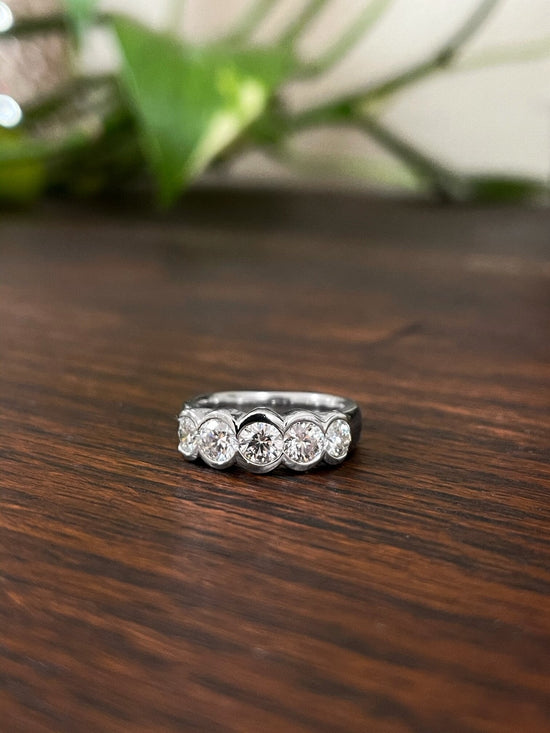 Photo of Plumb Gold Original Platinum Diamond Statement Band in a decorative scene, designed by , available at Plumb Gold & Plumb Silver