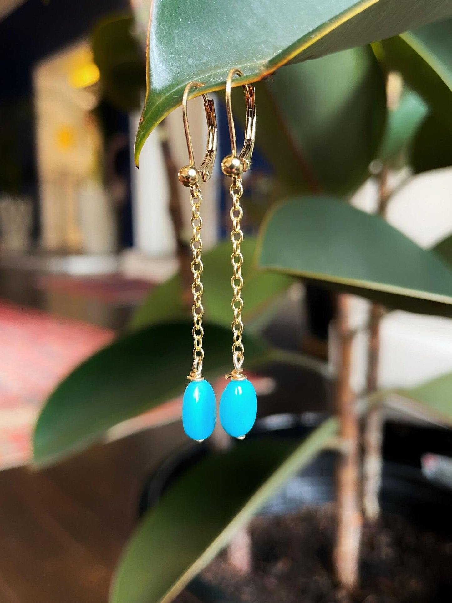 Photo of Plumb Silver Original Turquoise Earrings in a decorative scene, designed by , available at Plumb Gold & Plumb Silver