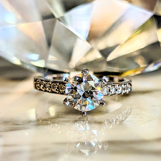 Photo of "Priscilla" Engagement Ring Mounting in a decorative scene, designed by , available at Plumb Gold & Plumb Silver