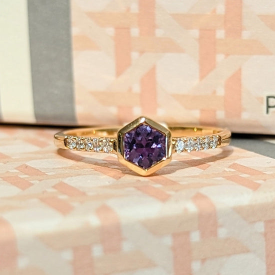 Photo of Purple Sapphire Hexagon Stackable Ring in a decorative scene, designed by , available at Plumb Gold & Plumb Silver