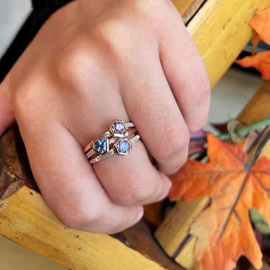Photo of Purple Sapphire Hexagon Stackable Ring in a decorative scene, designed by , available at Plumb Gold & Plumb Silver