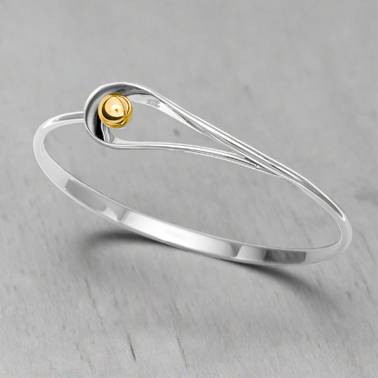 Photo of "Rendezvous" Bracelet in a decorative scene, designed by , available at Plumb Gold & Plumb Silver