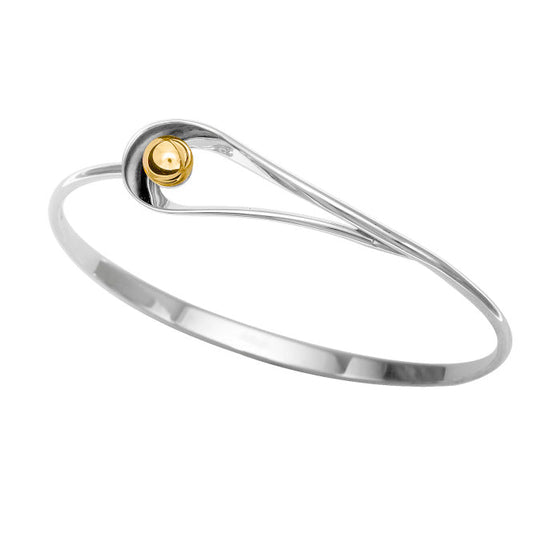 Photo of "Rendezvous" Bracelet in a decorative scene, designed by , available at Plumb Gold & Plumb Silver