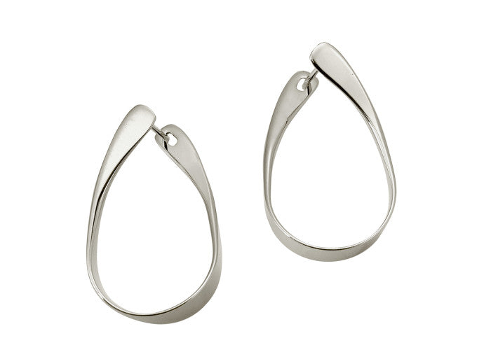 Photo of "Rhythmic Hoop" Earrings in a decorative scene, designed by , available at Plumb Gold & Plumb Silver