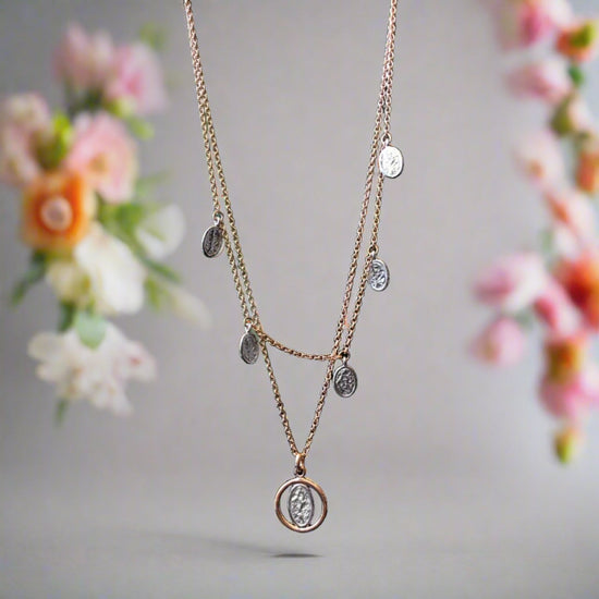 Photo of Rose Layered Necklace in a decorative scene, designed by , available at Plumb Gold & Plumb Silver