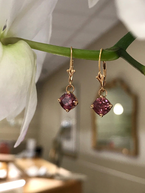 Photo of Rose Zircon Dangles in a decorative scene, designed by , available at Plumb Gold & Plumb Silver