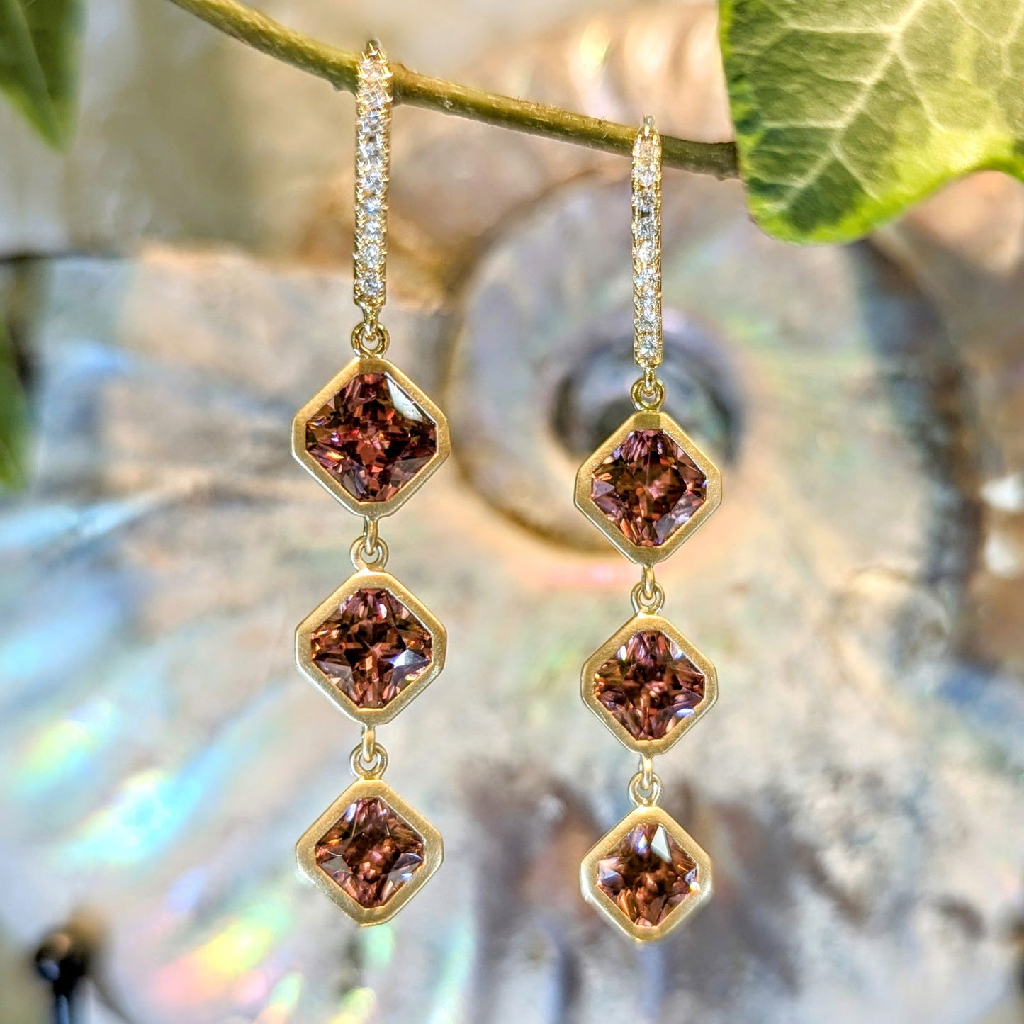 Photo of Rose Zircon Dangles in a decorative scene, designed by , available at Plumb Gold & Plumb Silver