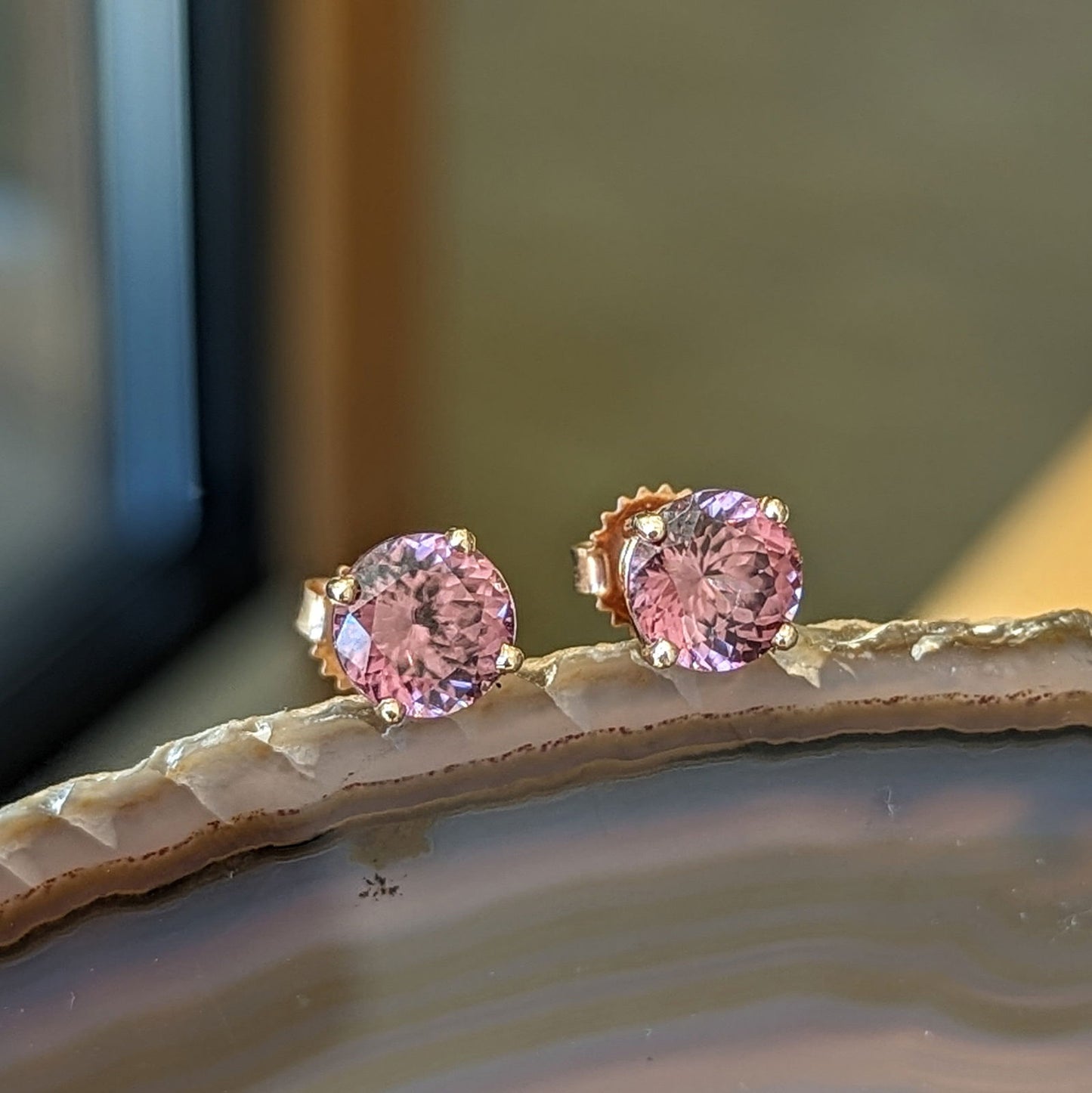 Photo of Rose Zircon Studs in a decorative scene, designed by , available at Plumb Gold & Plumb Silver