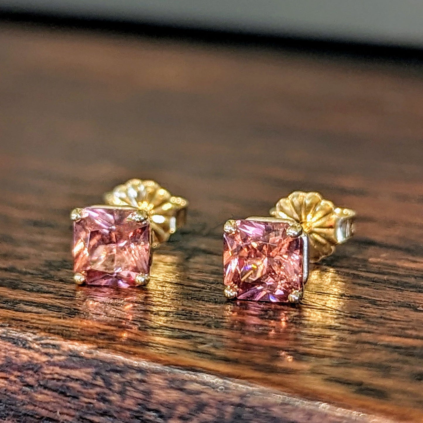 Photo of Rose Zircon Studs in a decorative scene, designed by , available at Plumb Gold & Plumb Silver