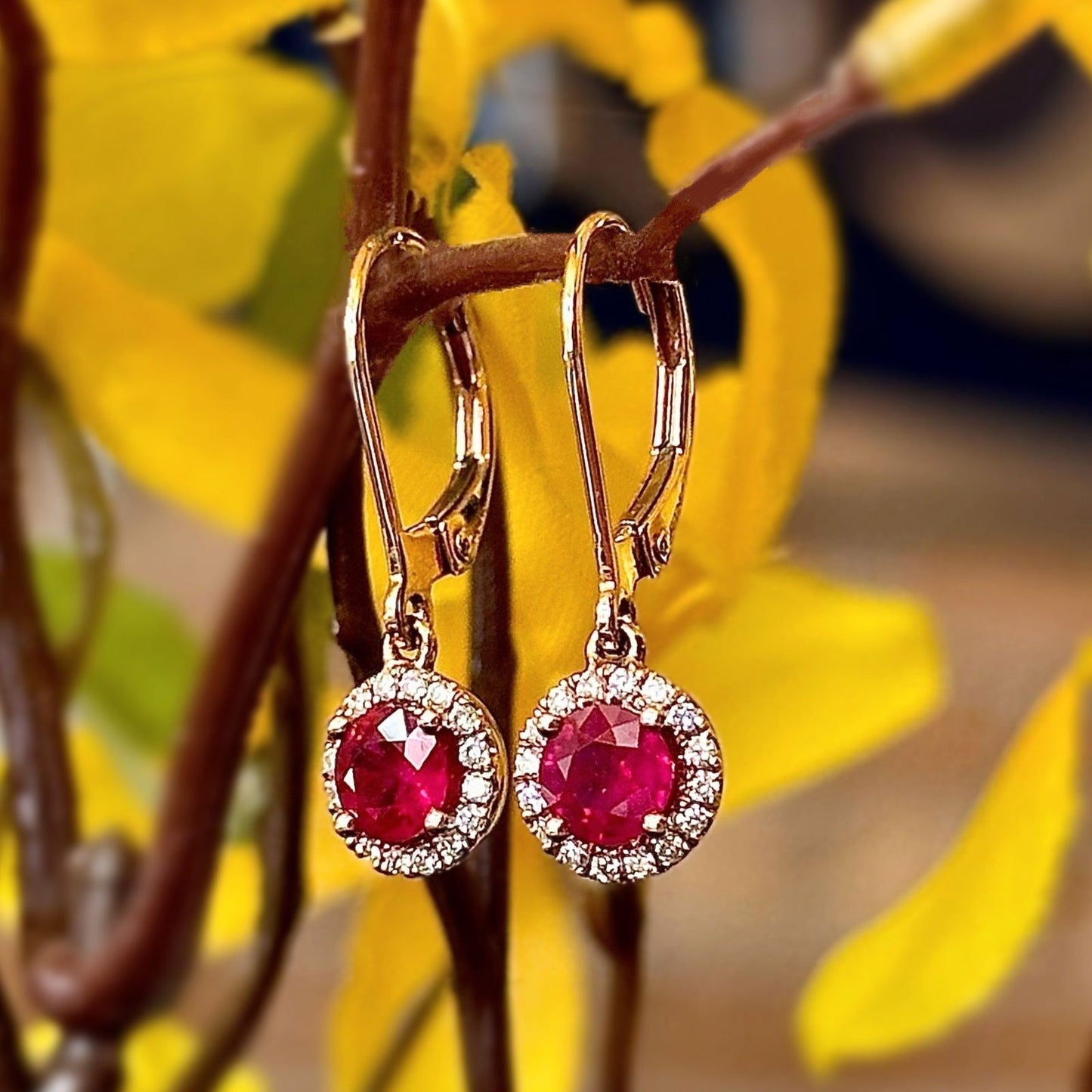 Photo of Rosy Ruby Halo Dangles in a decorative scene, designed by , available at Plumb Gold & Plumb Silver