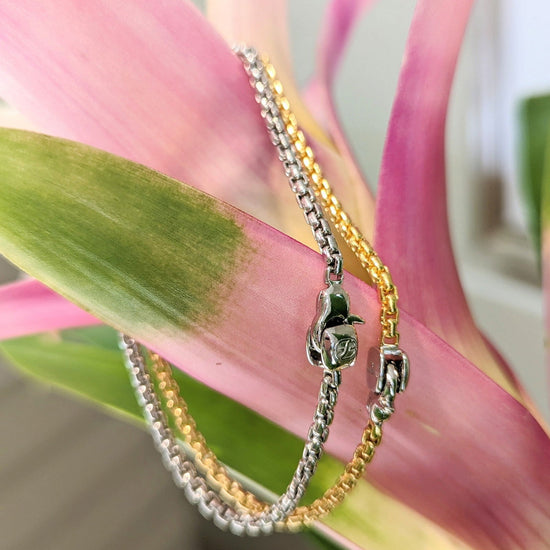 Photo of Rounded Box Chain Bracelet in a decorative scene, designed by , available at Plumb Gold & Plumb Silver