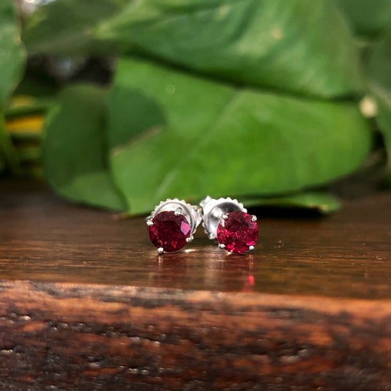 Photo of Rubelite Studs in a decorative scene, designed by , available at Plumb Gold & Plumb Silver