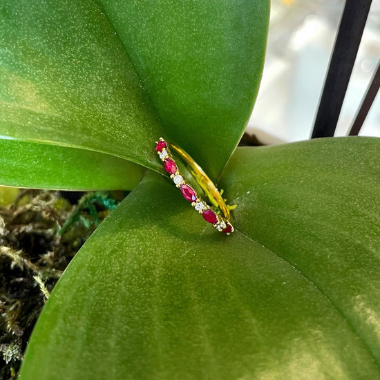Photo of Ruby and Diamond Ring in a decorative scene, designed by , available at Plumb Gold & Plumb Silver