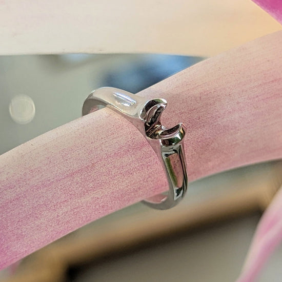 Photo of Semi Bezel Solitaire Mounting in a decorative scene, designed by , available at Plumb Gold & Plumb Silver