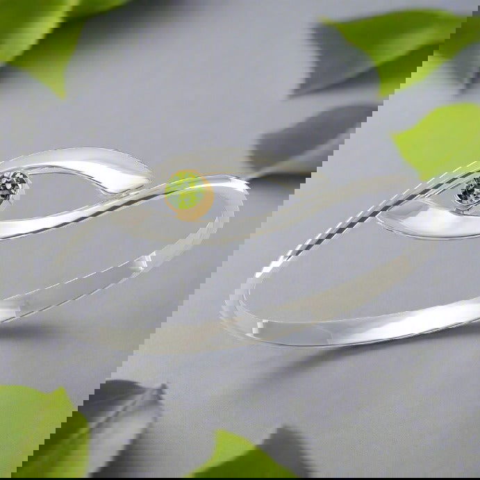 Photo of "Sensational Swing" Bracelet in a decorative scene, designed by , available at Plumb Gold & Plumb Silver