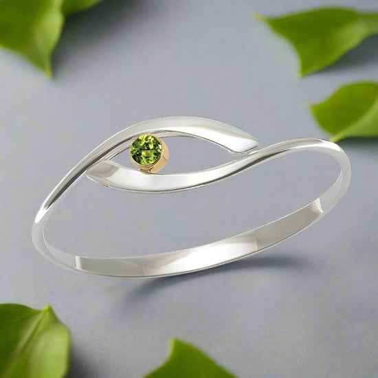 Photo of "Sensational Swing" Bracelet in a decorative scene, designed by , available at Plumb Gold & Plumb Silver