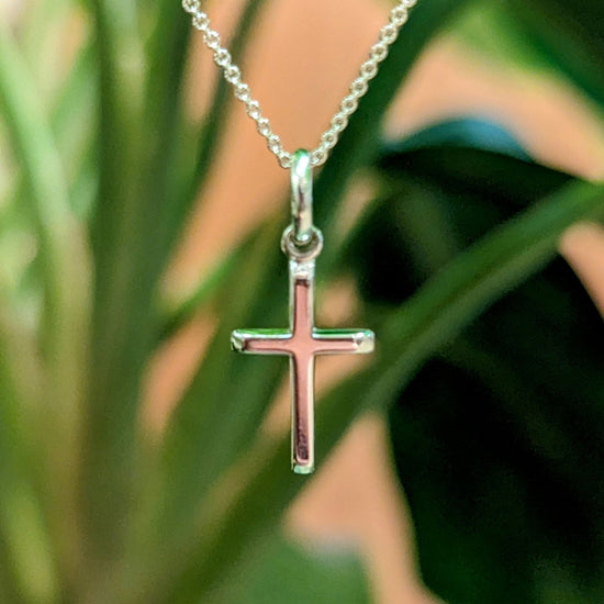 Photo of Small Classic Cross in a decorative scene, designed by , available at Plumb Gold & Plumb Silver