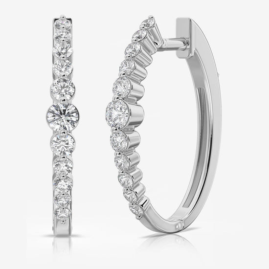 Photo of "Sonya" Diamond Hoops in a decorative scene, designed by , available at Plumb Gold & Plumb Silver
