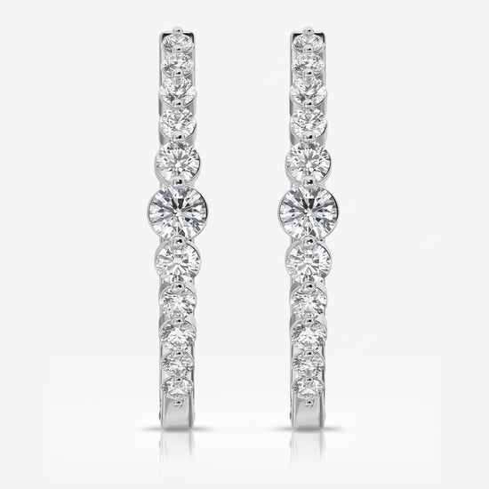 Photo of "Sonya" Diamond Hoops in a decorative scene, designed by , available at Plumb Gold & Plumb Silver